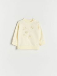 Bluza z aplikacją - żółty. Żółte bluzy i bluzki niemowlęce Reserved, z aplikacjami, z bawełny, bez ramiączek, bez kaptura. W wyprzedaży za 32.99 zł.