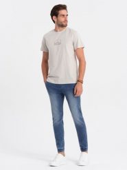 Spodnie męskie marmurkowe jeansowe JOGGERY - jasnoniebieskie V2 OM-PADJ-0133 - L. Niebieskie spodnie materiałowe męskie Ombre Clothing, bez wzorów, z bawełny. W wyprzedaży za 69.99 zł.