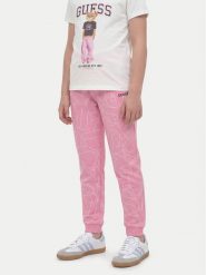 Guess Spodnie dresowe J6YB03 K3924 Różowy jasny Regular Fit. Czerwone spodnie dziewczęce Guess, z bawełny. Za 194.99 zł.
