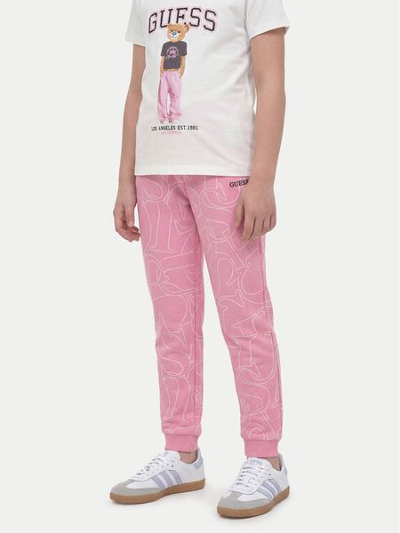 Guess Spodnie dresowe J6YB03 K3924 Różowy jasny Regular Fit. Czerwone spodnie dziewczęce Guess, z bawełny. Za 194.99 zł.