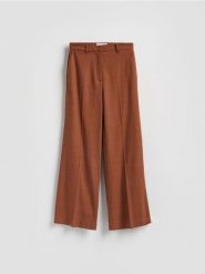 Spodnie z lnem - brązowy. Brązowe spodnie materiałowe damskie Reserved, bez wzorów, z tkaniny. Za 219.99 zł.