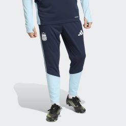 Spodnie Argentina 26 Tiro Training. Niebieskie spodnie dresowe męskie Adidas, bez wzorów, z dresówki. Za 279.00 zł.