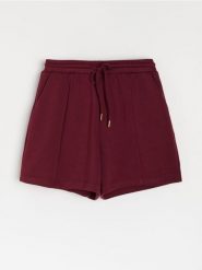 Szorty dresowe z wiązaniem - czerwony. Czerwone szorty damskie Sinsay, bez wzorów, z dresówki. Za 35.99 zł.