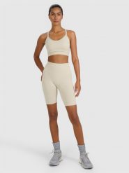 4F Legginsy kolarki treningowe bezszwowe damskie - beżowe M/L. Brązowe legginsy damskie 4f, l, bez wzorów, z dzianiny, z podwyższonym stanem, na fitness i siłownię. Za 119.99 zł.