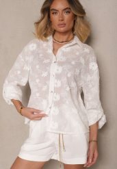 Biała Bawełniana Koszula o Kroju Oversize z Haftem w Kwiatowy Wzór Reisariel. Białe koszule damskie Renee, m, bez wzorów, z bawełny, eleganckie, bez kołnierzyka, bez ramiączek. Za 84.99 zł.