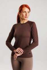 Koszulka treningowa bezszwowa damska z długim rękawem Dakota. Czerwone bluzki sportowe damskie Make Us Strong, s, z materiału, bez kołnierzyka, bez ramiączek. Za 124.99 zł.