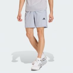 Tkane Szorty Do Ćwiczeń Essentials Base. Szare szorty męskie Adidas, bez wzorów, sportowe. Za 119.00 zł.