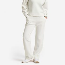 Spodnie dresowe damskie Gym & Pilates. Białe spodnie sportowe damskie Decathlon, l, z dresówki, na fitness i siłownię. Za 129.99 zł.