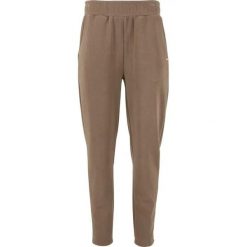 Damskie spodnie dresowe Athlecia Jillnana. Brązowe spodnie sportowe damskie Athlecia, z dresówki, na fitness i siłownię. Za 281.50 zł.