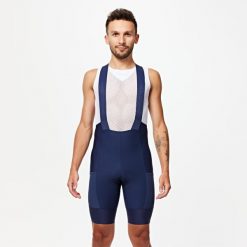 Spodenki rowerowe szosowe męskie Van Rysel Endurance na szelkach. Niebieskie szorty męskie VAN RYSEL, bez wzorów, sportowe. Za 239.99 zł.