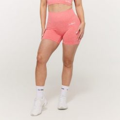 Szorty damskie fitness bezszwowe koralowe FLO. Czerwone spodenki sportowe damskie GYMBEAM, s, z elastanu, na fitness i siłownię. Za 89.90 zł.