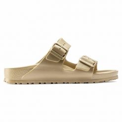 Klapki Birkenstock Arizona 1022465 złoty. Żółte klapki damskie bez wzorów, z materiału, bez obcasa. Za 361.45 zł.
