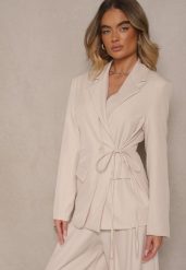 Jasnobeżowa Marynarka Ozdobiona Wiązaniem z Boku Lunorisa. Brązowe marynarki i żakiety damskie Renee, l, bez wzorów, eleganckie. Za 119.99 zł.