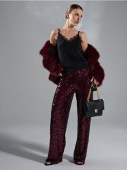 Spodnie wide leg z błyszczącymi cekinami - bordowy. Czerwone spodnie materiałowe damskie Sinsay, bez wzorów. Za 69.99 zł.