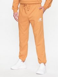 New Balance Spodnie dresowe MP31539 Żółty Regular Fit. Żółte spodnie dresowe męskie New Balance, bez wzorów, z dresówki. Za 269.99 zł.