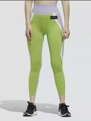 Adidas Legginsy sportowe w kolorze fioletowo-zielonym rozmiar: XS. Różowe legginsy damskie Adidas, xs, bez wzorów, z materiału. Za 92.21 zł.