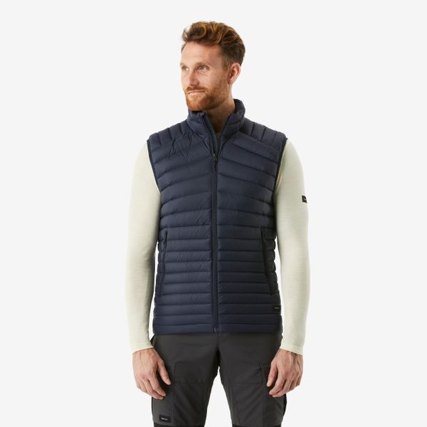 Kamizelka trekkingowa męska puchowa Forclaz MT100. Niebieskie kamizelki męskie FORCLAZ, l, z materiału. Za 229.99 zł.