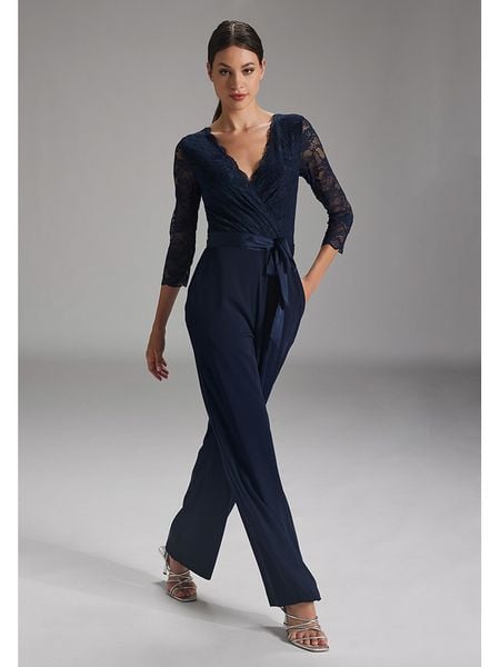 SWING Kombinezon w kolorze granatowym rozmiar: 34. Niebieskie kombinezony damskie Swing, bez wzorów, z koronki, bez kołnierzyka, bez ramiączek. Za 296.56 zł.