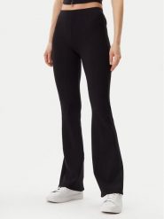 Guess Legginsy V5GB11 KCRS2 Czarny Regular Fit. Czarne legginsy sportowe damskie Guess, s, z aplikacjami, z wiskozy. Za 199.99 zł.