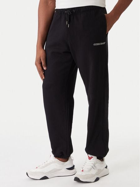 Guess Jeans Spodnie dresowe M6RB70 KCPR1 Czarny Regular Fit. Czarne spodnie dresowe męskie Guess Jeans, z aplikacjami, z bawełny. Za 299.99 zł.