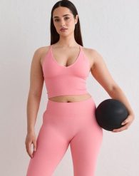 Damski biustonosz sportowy bezszwowy, z wyjmowanymi wkładkami Shape jasnoróżowy. Brązowe biustonosze sportowe damskie Aim'n, bez wzorów, z elastanu. Za 212.00 zł.