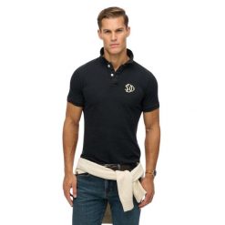 Haftowana koszulka polo Superdry Vintage Athletic. Niebieskie koszulki polo męskie Superdry., m, bez wzorów, bez ramiączek. Za 247.70 zł.
