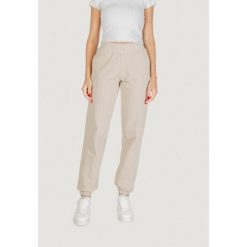 Spodnie Kobieta GUESS ACTIVE PRIMULA RHINESTONES JOGGER. Brązowe spodnie dresowe damskie Guess Active. W wyprzedaży za 309.90 zł.