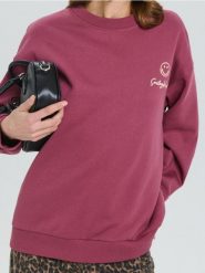 Bluza z nadrukiem na plecach SmileyWorld® - czerwony. Czerwone bluzy bez kaptura damskie Sinsay, l. W wyprzedaży za 27.99 zł.