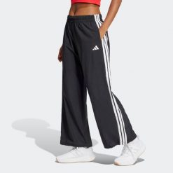 Spodnie damskie ADIDAS. Czarne spodnie materiałowe damskie Adidas, bez wzorów, z poliamidu, eleganckie. Za 219.99 zł.