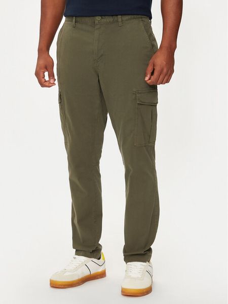 Tommy Jeans Spodnie materiałowe Austin DM0DM20750 Zielony Slim Fit. Zielone spodnie materiałowe męskie Tommy Jeans, bez wzorów, z bawełny. Za 359.99 zł.