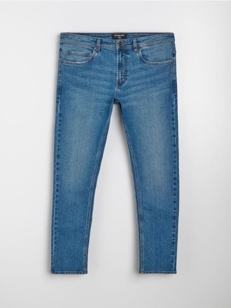 Jeansy slim fit z efektem sprania - granatowy. Niebieskie jeansy męskie Sinsay. Za 49.99 zł.