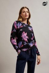 Sweter w kwiaty z długimi rękawami fioletowy. Fioletowe swetry klasyczne damskie MOODO, m, z elastanu, bez kołnierzyka. W wyprzedaży za 34.99 zł.