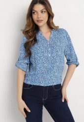 Jasnoniebieska Wiskozowa Bluzka z Asymetrycznym Dołem i Guziczkami Nolvira. Niebieskie bluzki damskie Born2be, s, bez wzorów, z wiskozy, eleganckie, z asymetrycznym kołnierzem, bez ramiączek. Za 29.99 zł.