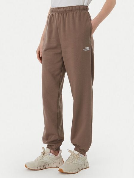 The North Face Spodnie dresowe Evolution Simple Dome NF0A8CWV Brązowy jasny Regular Fit. Brązowe spodnie dresowe damskie The North Face, s, bez wzorów, z dresówki. Za 279.99 zł.