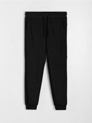 Spodnie jogger dresowe pique - czarny. Czarne spodnie sportowe męskie Sinsay, z dresówki. W wyprzedaży za 25.99 zł.