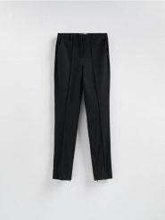 Spodnie z suwakami - czarny. Czarne spodnie materiałowe damskie Reserved, bez wzorów, z dzianiny. Za 139.99 zł.