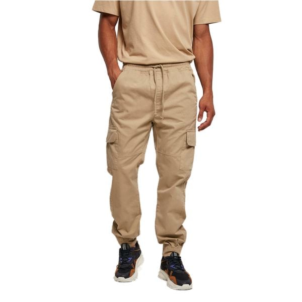 Spodnie dresowe Urban Classics Military. Brązowe spodnie dresowe męskie Urban Classics, bez wzorów, z dresówki. Za 237.00 zł.