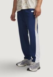 Spodnie Mężczyzna UNDER ARMOUR UA RIVAL WOVEN CB PANTS. Niebieskie spodnie sportowe męskie Under Armour. Za 359.90 zł.