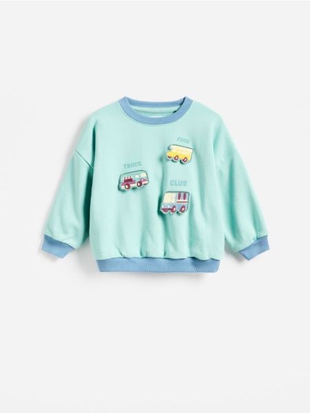 Bluza z aplikacją - jasnoturkusowy. Niebieskie bluzy i bluzki niemowlęce Reserved, z aplikacjami, z bawełny, bez ramiączek, bez kaptura. Za 55.99 zł.