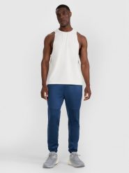 4F Spodnie treningowe szybkoschnące męskie - granatowe XL. Niebieskie spodnie sportowe męskie 4f, z dzianiny. Za 229.99 zł.