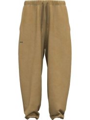 Under Armour Spodnie dresowe "Icon" w kolorze jasnobrązowym rozmiar: S. Brązowe spodnie dresowe damskie Under Armour, s, bez wzorów, z bawełny. Za 204.96 zł.