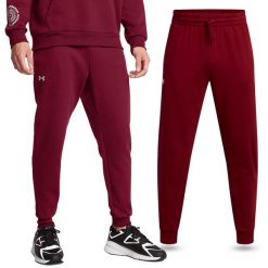 Spodnie dresowe męskie Under Armour joggery na trening. Czerwone spodnie dresowe męskie Under Armour, bez wzorów, z dresówki. Za 179.99 zł.