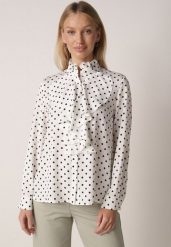 Biała Wiskozowa Koszula w Kropki ze Stójką z Ozdobnymi Falbanami Isamene. Białe koszule damskie Born2be, m, bez wzorów, z jeansu, klasyczne, bez kołnierzyka, bez ramiączek. Za 129.99 zł.
