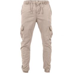 Klasyczne spodnie miejskie cargo jogging gt. Białe spodnie materiałowe męskie Urban Classics, bez wzorów, z bawełny, klasyczne. Za 233.85 zł.