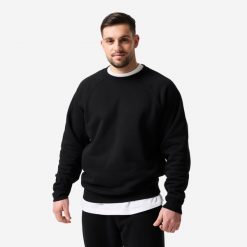 Bluza sportowa męska Domyos. Czarne bluzy sportowe męskie DOMYOS, bez wzorów, z bawełny, sportowe, bez kołnierzyka, bez ramiączek. Za 159.99 zł.