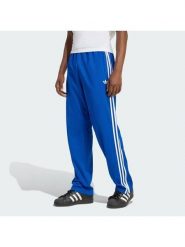 Adidas Spodnie dresowe adicolor Firebird KD4079 Niebieski Regular Fit. Niebieskie spodnie dresowe męskie Adidas, bez wzorów, z dresówki. Za 299.99 zł.