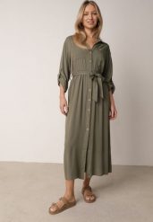 Zielona Bawełniana Sukienka Koszulowa z Paskiem i Regulowanymi Rękawami Sadevia. Zielone sukienki damskie Born2be, do pracy, l, bez wzorów, z bawełny, biznesowe, bez kołnierzyka, bez ramiączek, maxi, koszulowe. Za 119.99 zł.