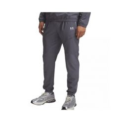 Spodnie dresowe Under armour model 6004046-25 dla mężczyzn. Białe spodnie sportowe męskie Under Armour, z dresówki. Za 318.35 zł.