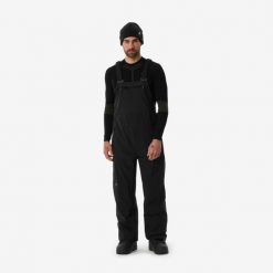 Spodnie snowboardowe ogrodniczki męskie Dreamscape SNB BIB 900. Brązowe spodnie materiałowe męskie DREAMSCAPE, bez wzorów, z materiału, sportowe. Za 799.99 zł.
