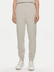Calvin Klein Spodnie dresowe Micro Logo K20K206632 Beżowy Regular Fit. Brązowe spodnie dresowe damskie CALVIN KLEIN, m, bez wzorów, z bawełny. Za 359.99 zł.